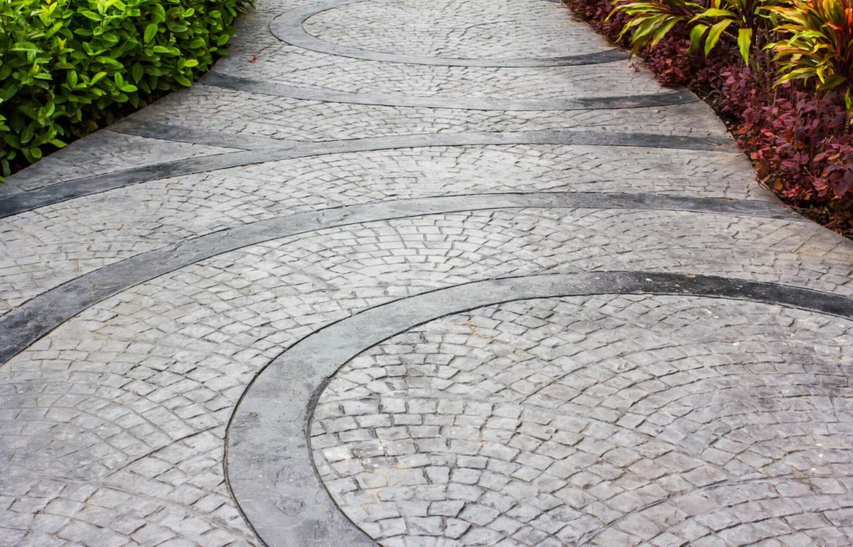 Beautiful decorative stamped concrete walkway with custom pattern